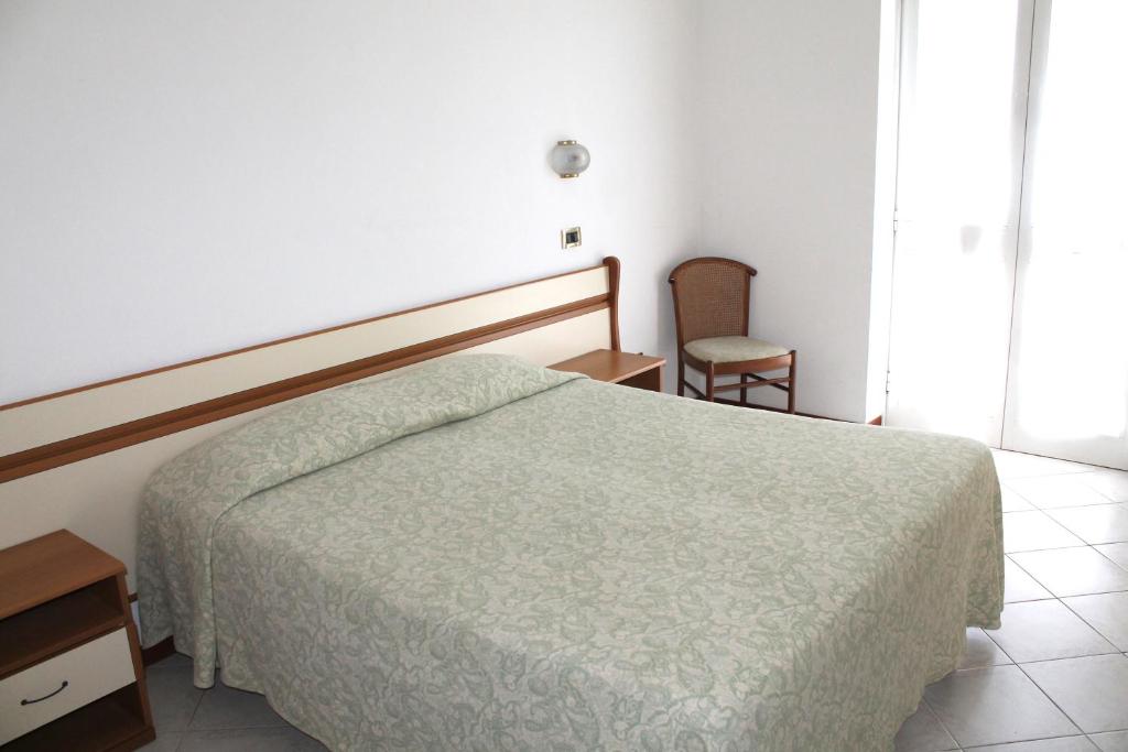 Postel nebo postele na pokoji v ubytování Hotel I 4 Assi
