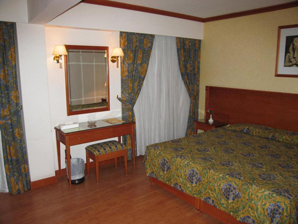 Postel nebo postele na pokoji v ubytování Philippe Luxor Hotel
