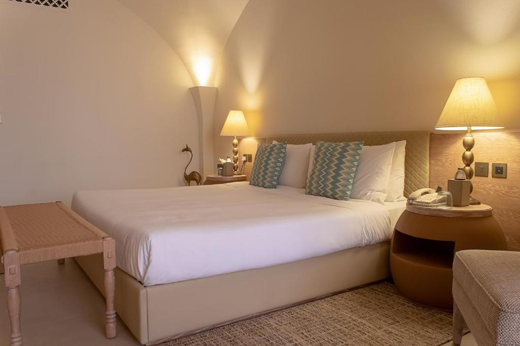 Postel nebo postele na pokoji v ubytování Liwa Hotel
