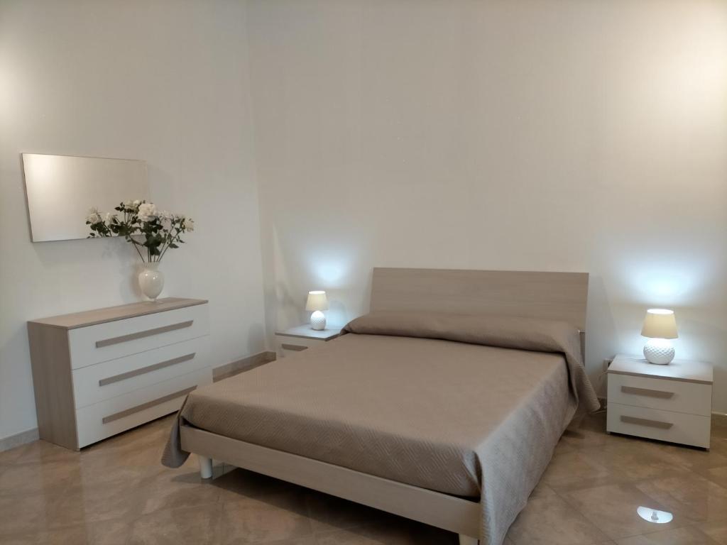 Postel nebo postele na pokoji v ubytování LaRosa Maruggio