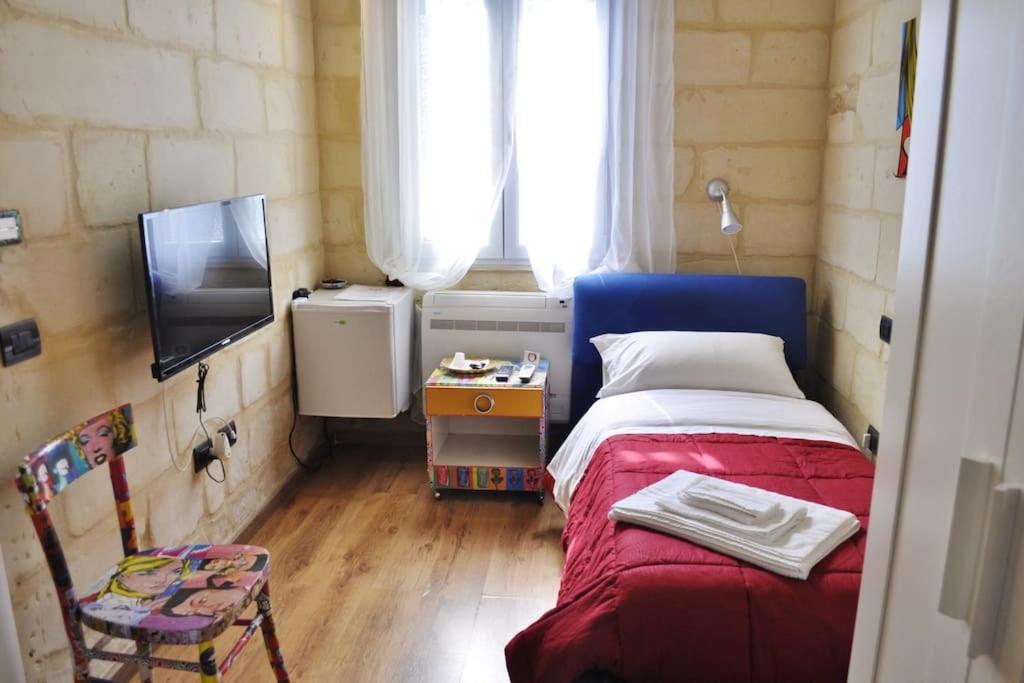 Postel nebo postele na pokoji v ubytování B&B Lecce Holidays