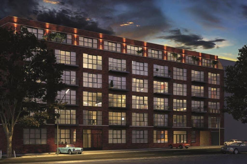 a large building with many windows at night at Stylisches Loft-Apartment mitten in Berlin in Berlin