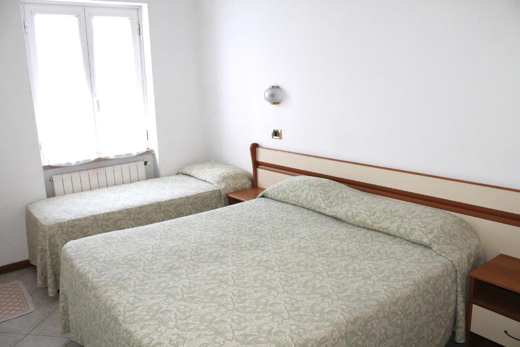 Postel nebo postele na pokoji v ubytování Hotel I 4 Assi
