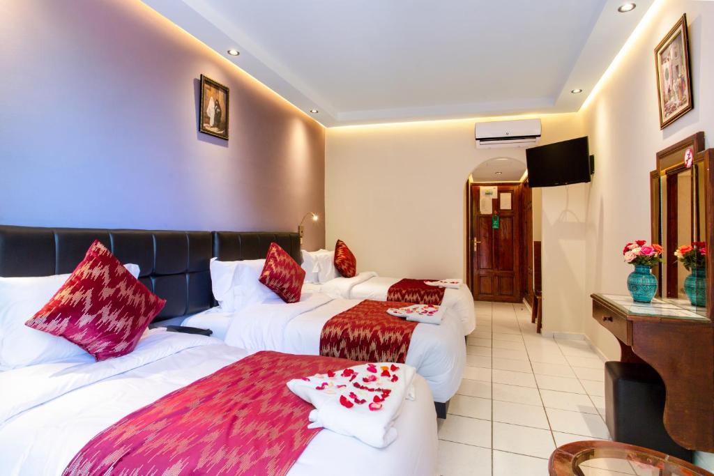 Postel nebo postele na pokoji v ubytování Hotel Akabar