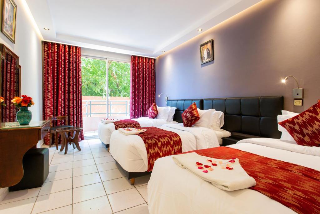 Postel nebo postele na pokoji v ubytování Hotel Akabar