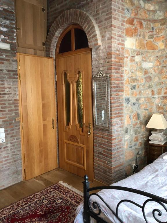 A bed or beds in a room at Lykos Mansion