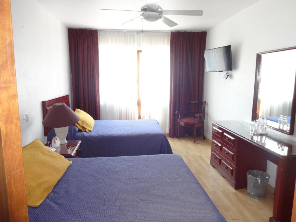 Posteľ alebo postele v izbe v ubytovaní Gala Oaxaca