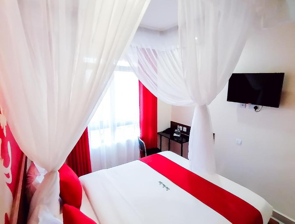 Postel nebo postele na pokoji v ubytování Divine Homes Resort Kisumu