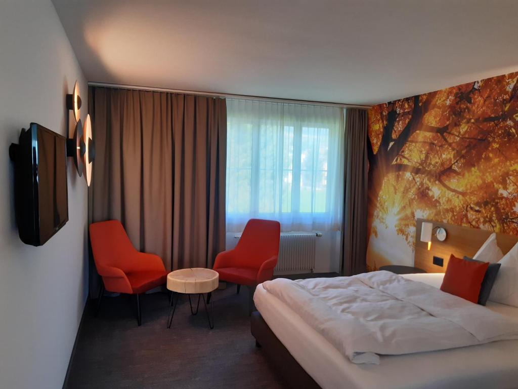 Postel nebo postele na pokoji v ubytování Hotel Urs und Viktor