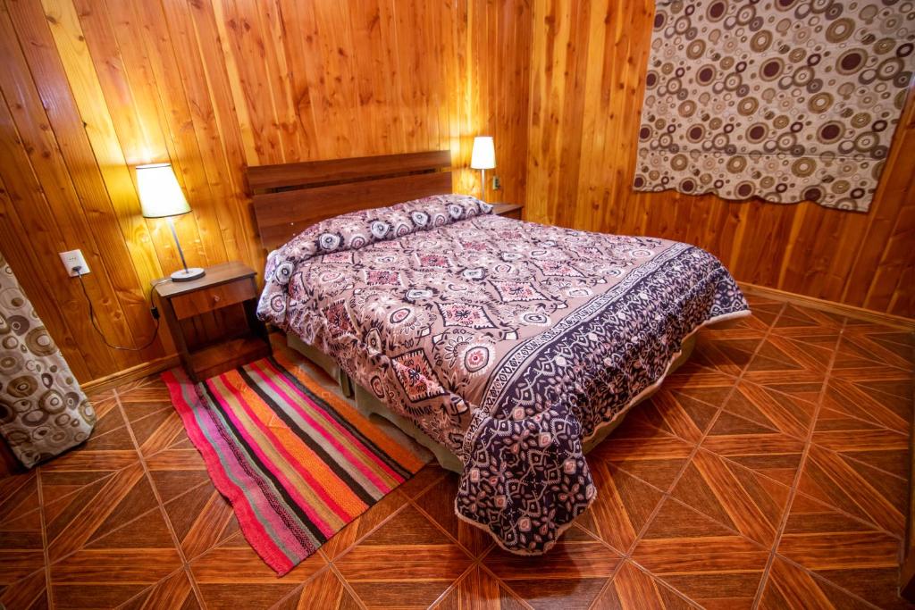 Postel nebo postele na pokoji v ubytování Cabañas Antulaf