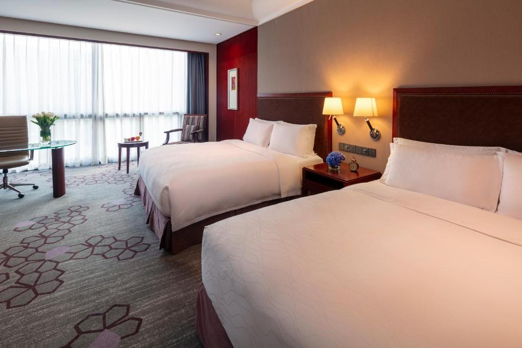 Postel nebo postele na pokoji v ubytování Jin Jiang International Hotel Xi'an