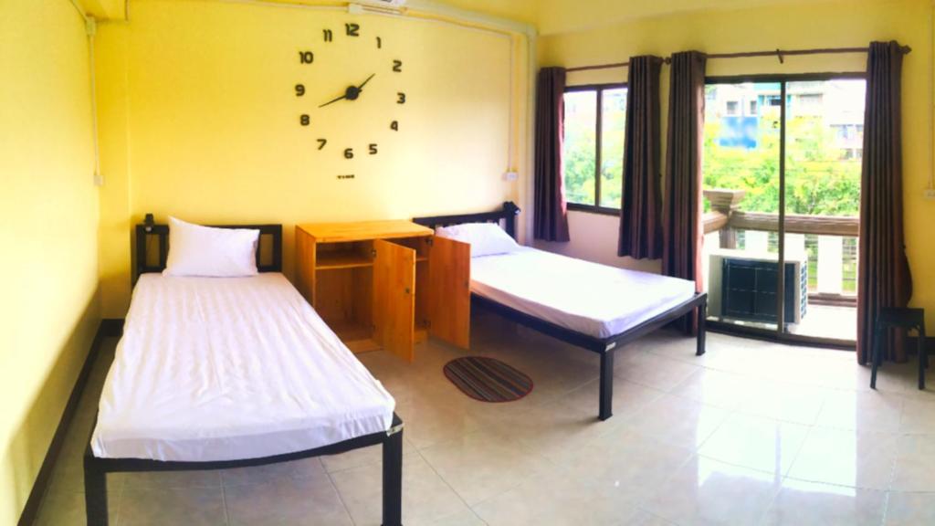 Postel nebo postele na pokoji v ubytování Inncome Hostel