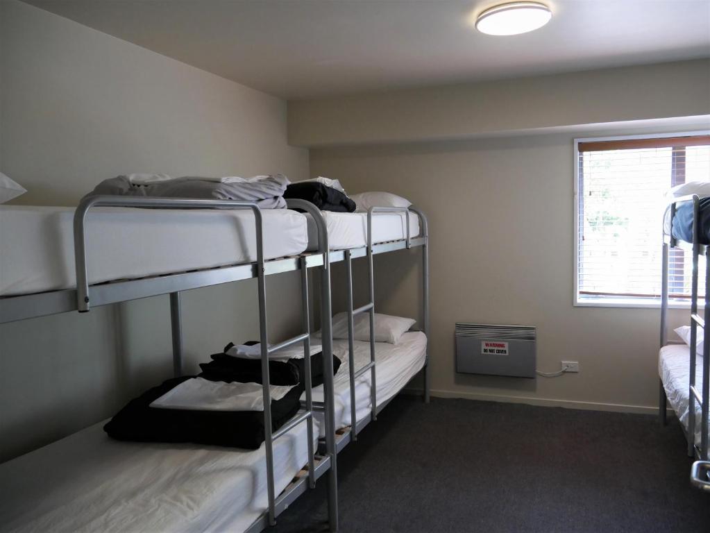 Postel nebo postele na pokoji v ubytování Kaiteri Lodge