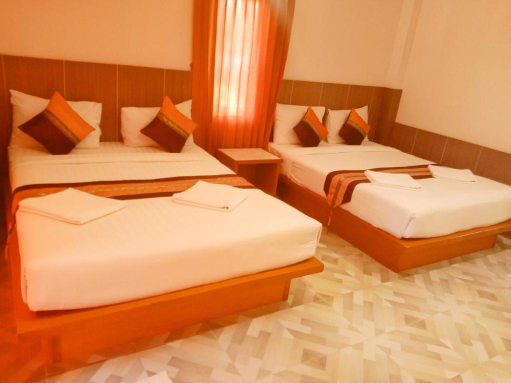 Postel nebo postele na pokoji v ubytování Kaibae Hut Resort
