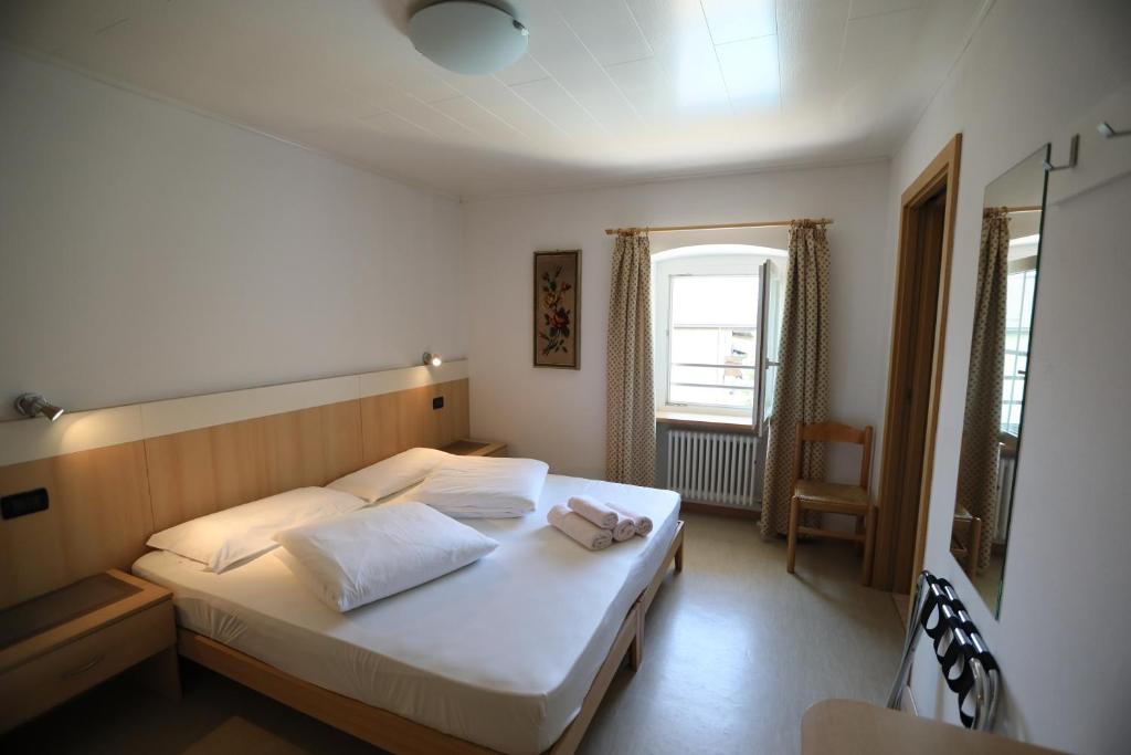 Postel nebo postele na pokoji v ubytování Hotel Stampfer B&B
