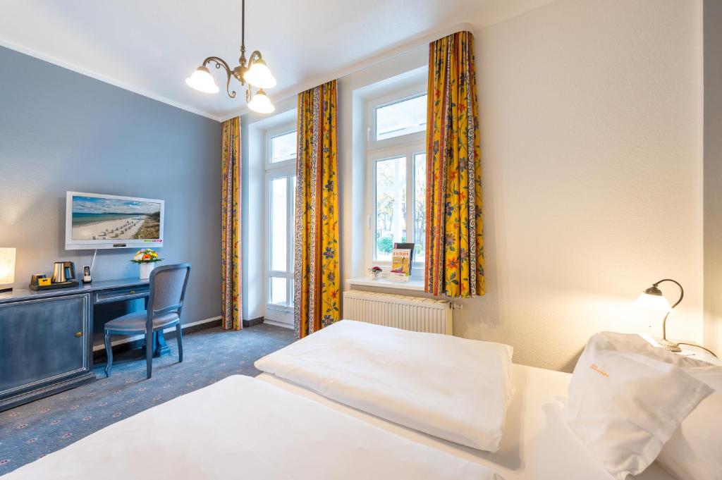 Postel nebo postele na pokoji v ubytování Hotel Garni Getreuer Eckart