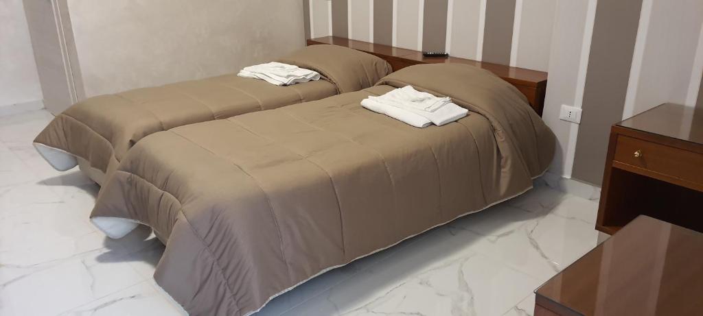 Postel nebo postele na pokoji v ubytování Hotel Holiday