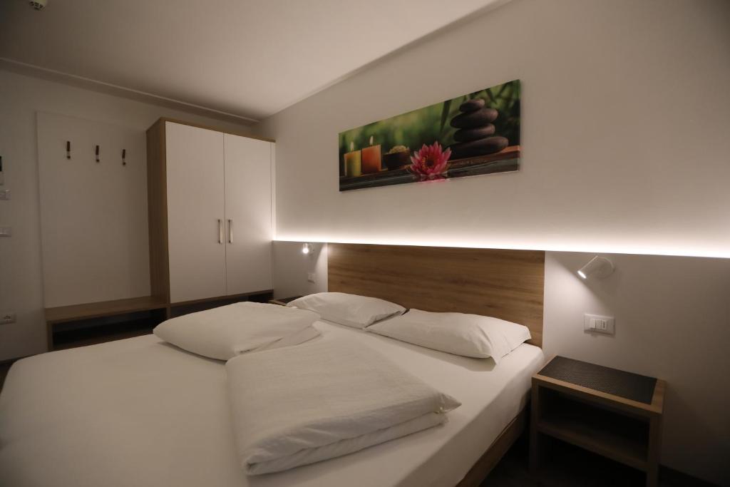 Postel nebo postele na pokoji v ubytování Hotel Stampfer B&B