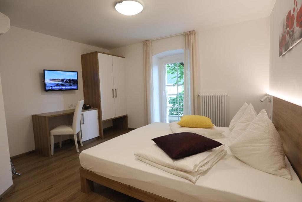 Postel nebo postele na pokoji v ubytování Hotel Stampfer B&B