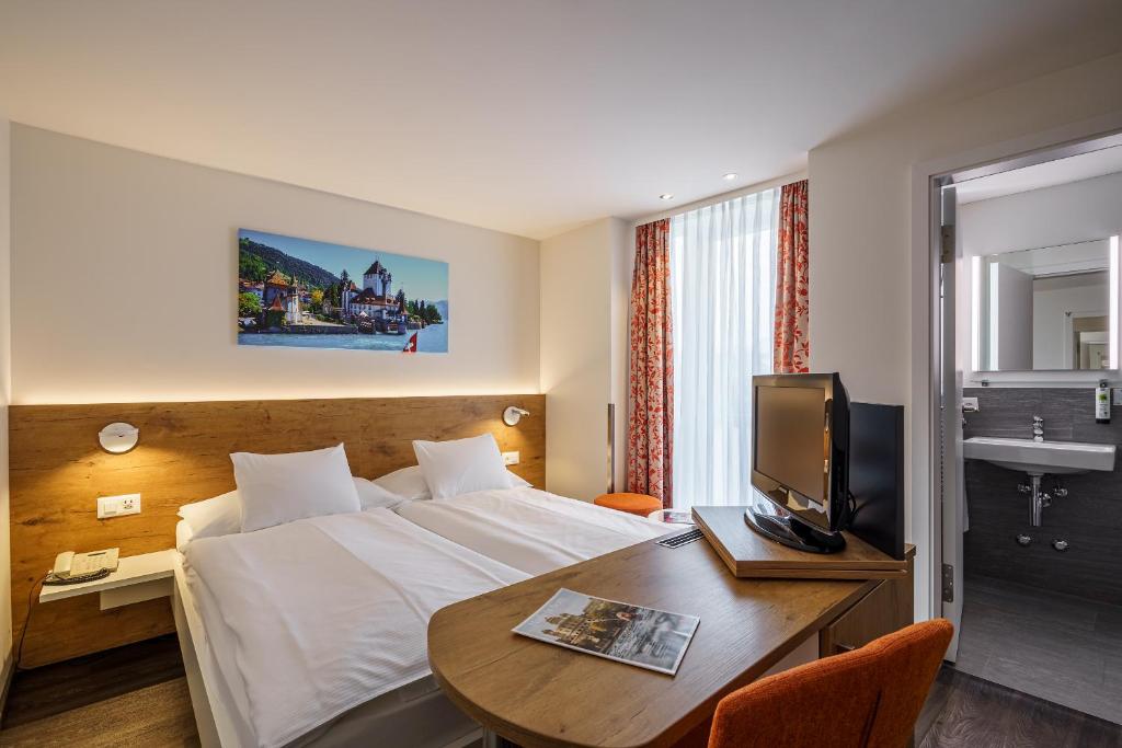 Postel nebo postele na pokoji v ubytování Hotel Bernerhof