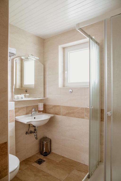 Koupelna v ubytování Apartments Kristan