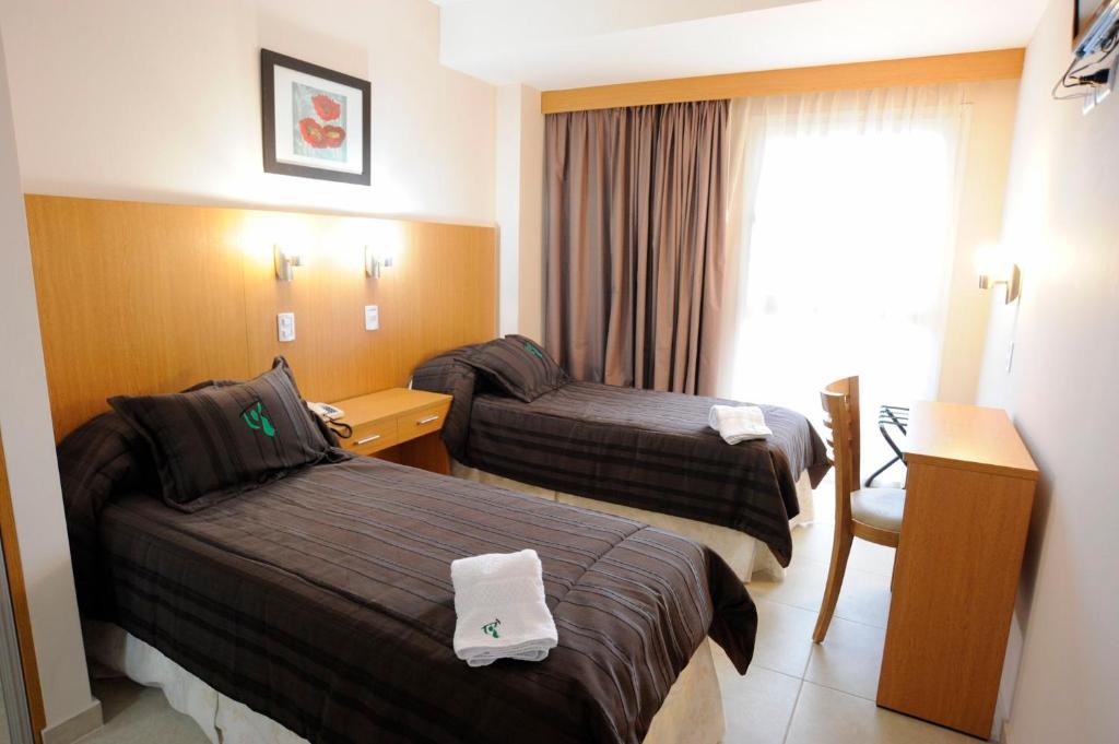 Posteľ alebo postele v izbe v ubytovaní Hotel Osam