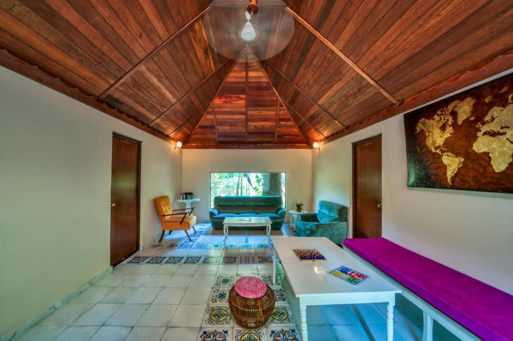 a living room with a couch and a table at Munjoh Ocean Resort - Private Beachfront Luxury Retreat in Havelock in Havelock Island