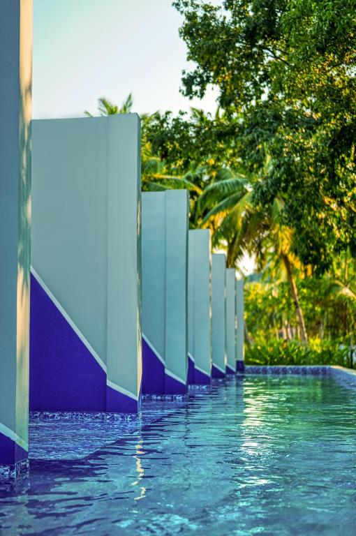 a pool with blue and white dividers in the water at Munjoh Ocean Resort - Private Beachfront Luxury Retreat in Havelock in Havelock Island