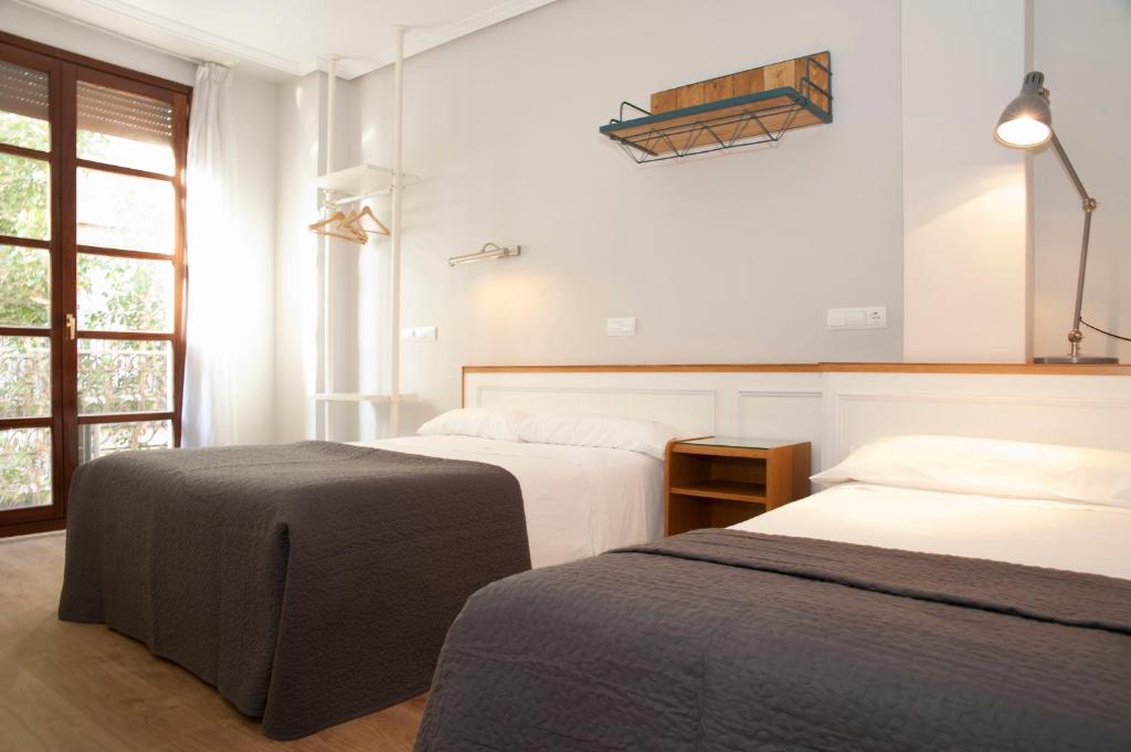 Postel nebo postele na pokoji v ubytování Apartamentos Sabinas Don Jaime
