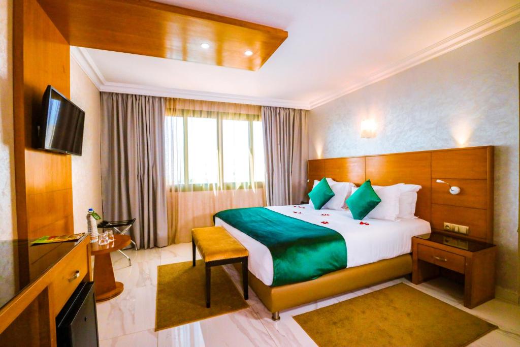 Rúm í herbergi á Hotel Argana Agadir