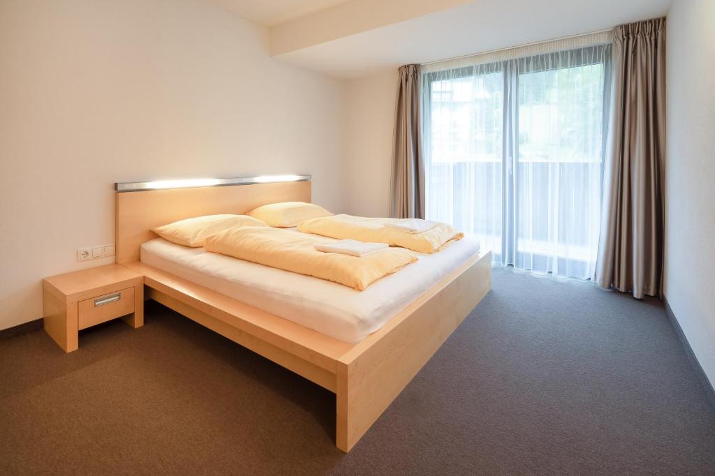 Postel nebo postele na pokoji v ubytování Bohemia Apartments