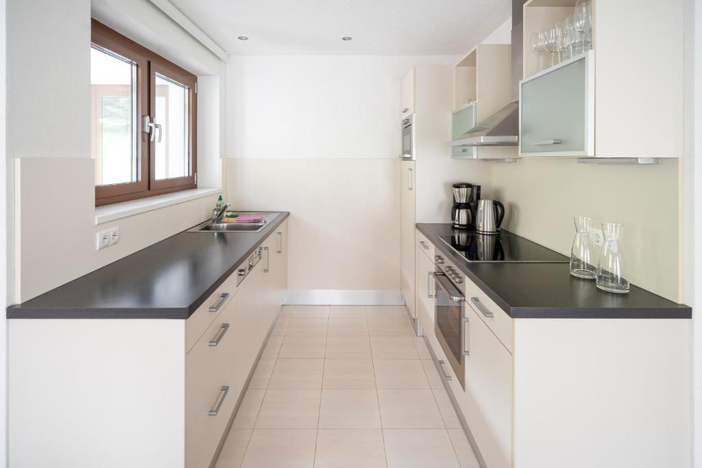 Kuchyň nebo kuchyňský kout v ubytování Bohemia Apartments