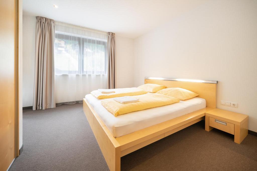 Postel nebo postele na pokoji v ubytování Bohemia Apartments