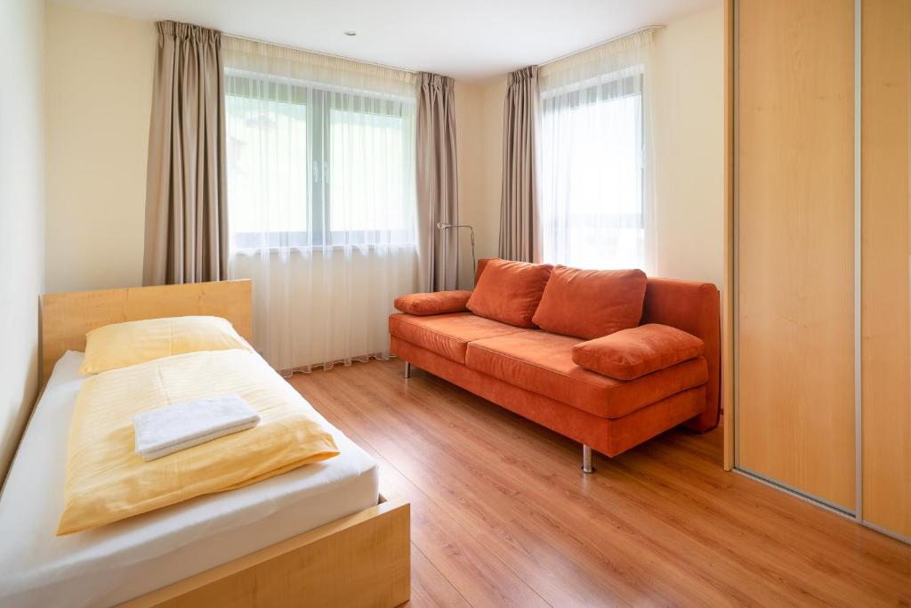 Postel nebo postele na pokoji v ubytování Bohemia Apartments