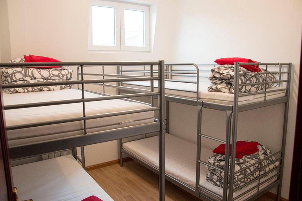 two bunk beds in a room with a window at Art Beaubourg in Paris