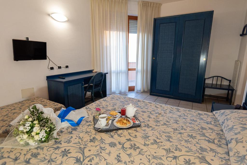 Posteľ alebo postele v izbe v ubytovaní Hotel il Delfino