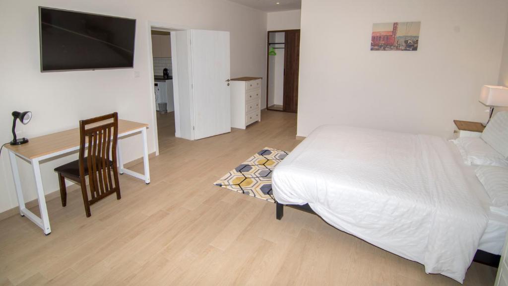 Postel nebo postele na pokoji v ubytování New Brookfields Hotel
