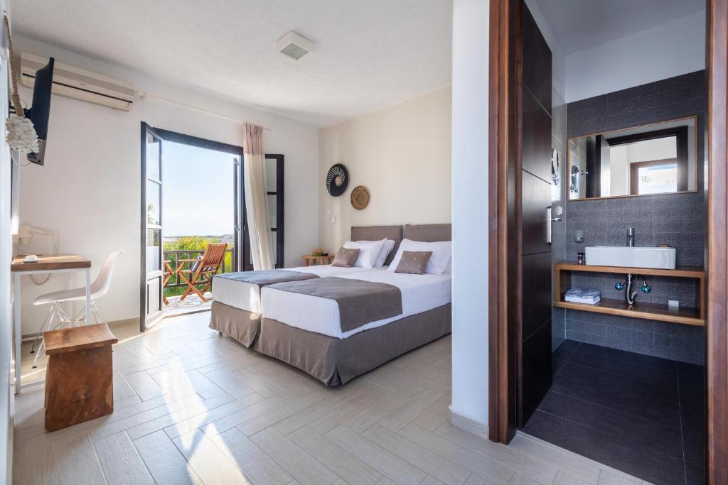 Postel nebo postele na pokoji v ubytování Aella Residence