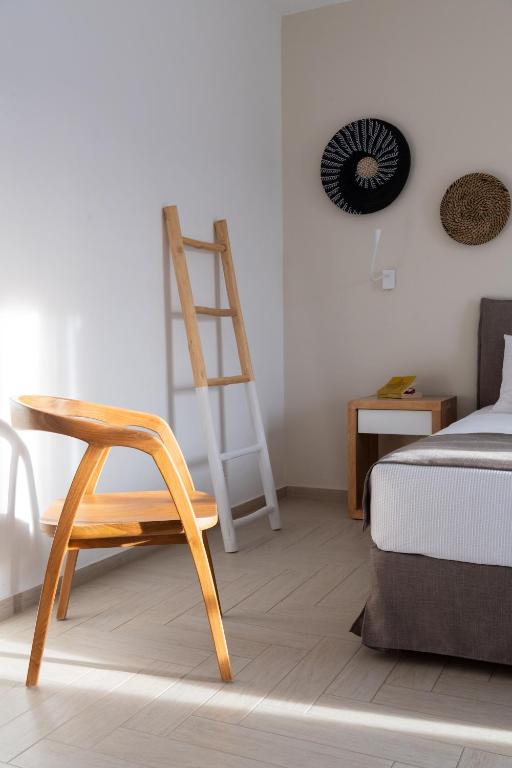 Postel nebo postele na pokoji v ubytování Aella Residence