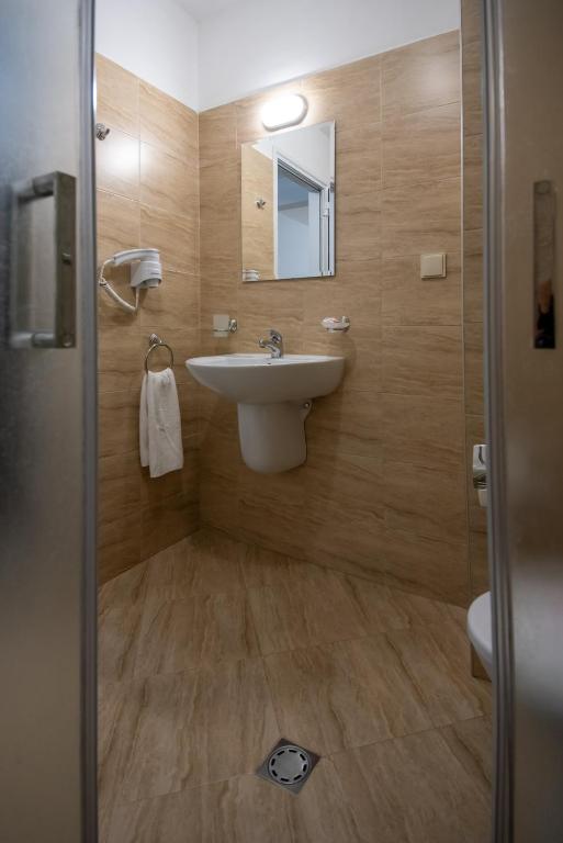 Koupelna v ubytování Ariana Hotel