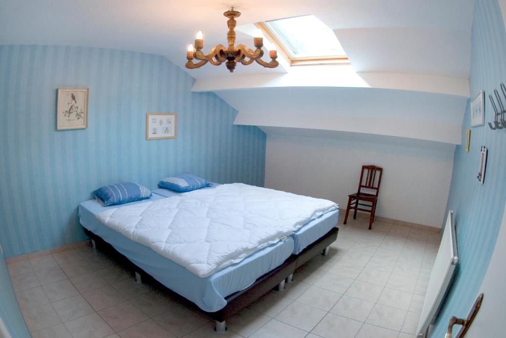 Postel nebo postele na pokoji v ubytování Holiday Home Le Pihon