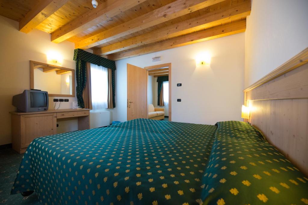 Postel nebo postele na pokoji v ubytování Hotel Dall'Ongaro