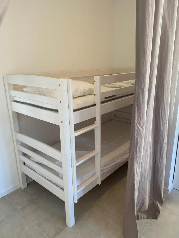 Postel nebo postele na pokoji v ubytování Résidence Casarella Lama