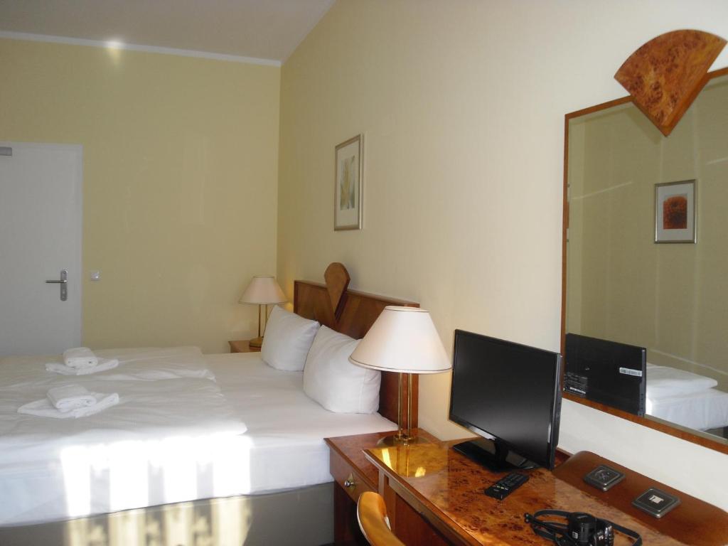 Postel nebo postele na pokoji v ubytování Hotel Amadeus Central