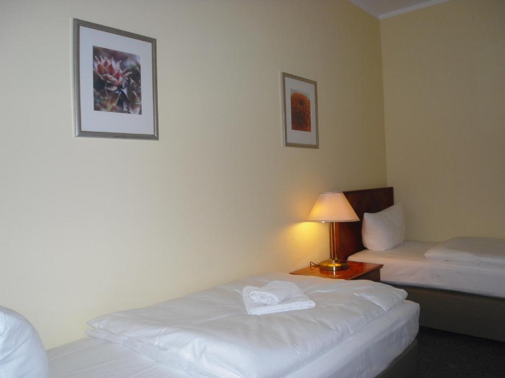 Postel nebo postele na pokoji v ubytování Hotel Amadeus Central