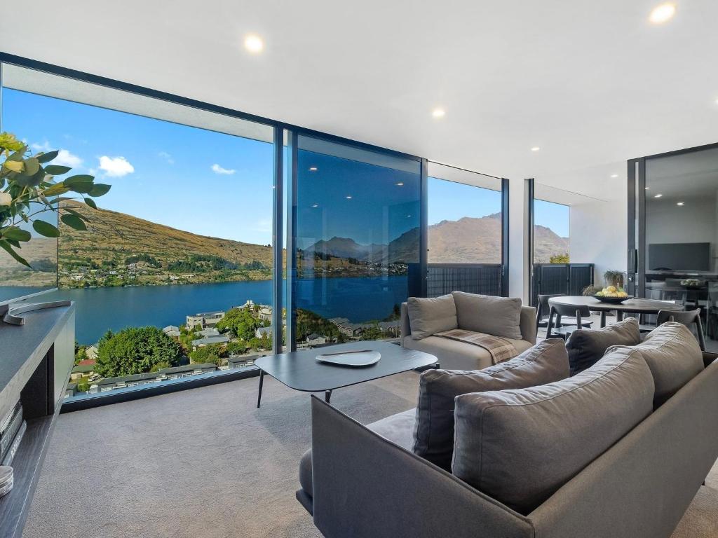 a living room with a large view of the water at The Bunker Alpha B in Queenstown