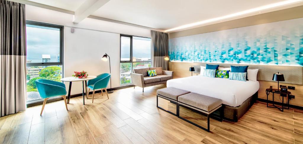 Postel nebo postele na pokoji v ubytování Tanoa Plaza Hotel