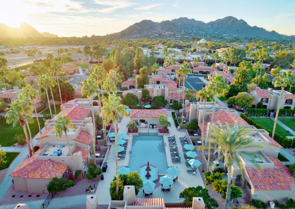 an aerial view of a resort with a pool and palm trees at The Scottsdale Plaza Resort & Villas in Scottsdale
