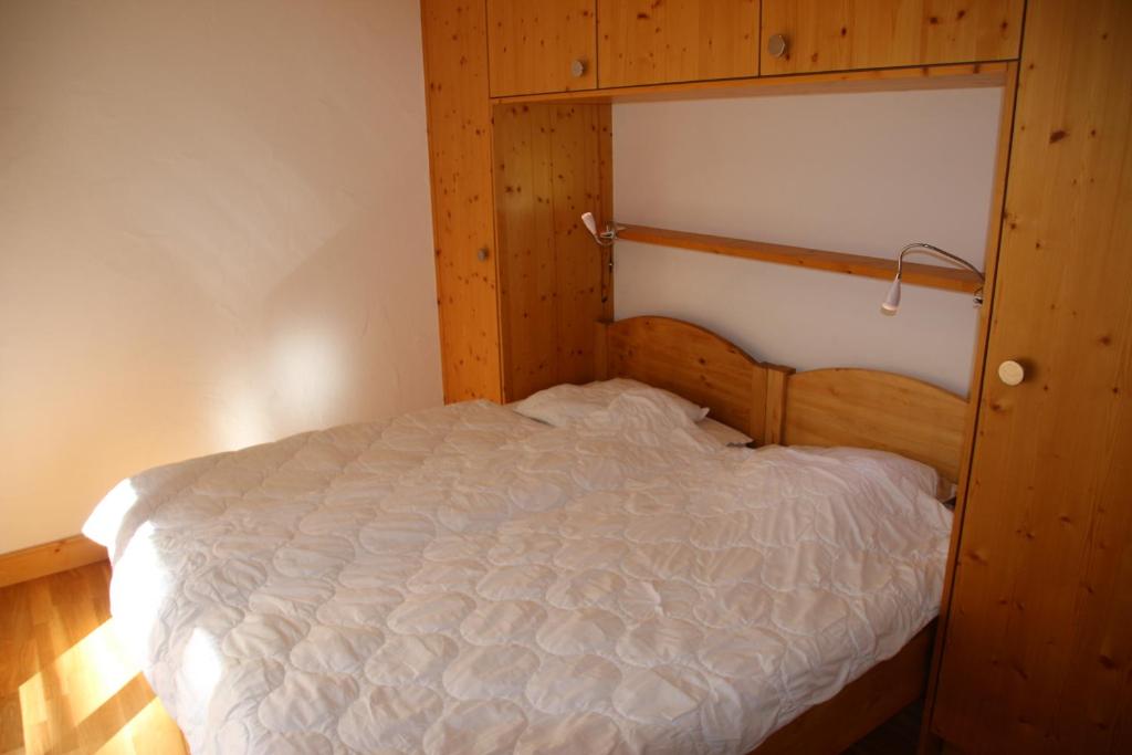 Postel nebo postele na pokoji v ubytování Plein Ciel LUXE & MOUNTAIN apartments by Alpvision Résidences