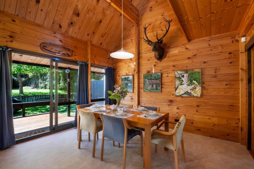a dining room with a table and chairs at Lake Terrace Lockwood in Taupo